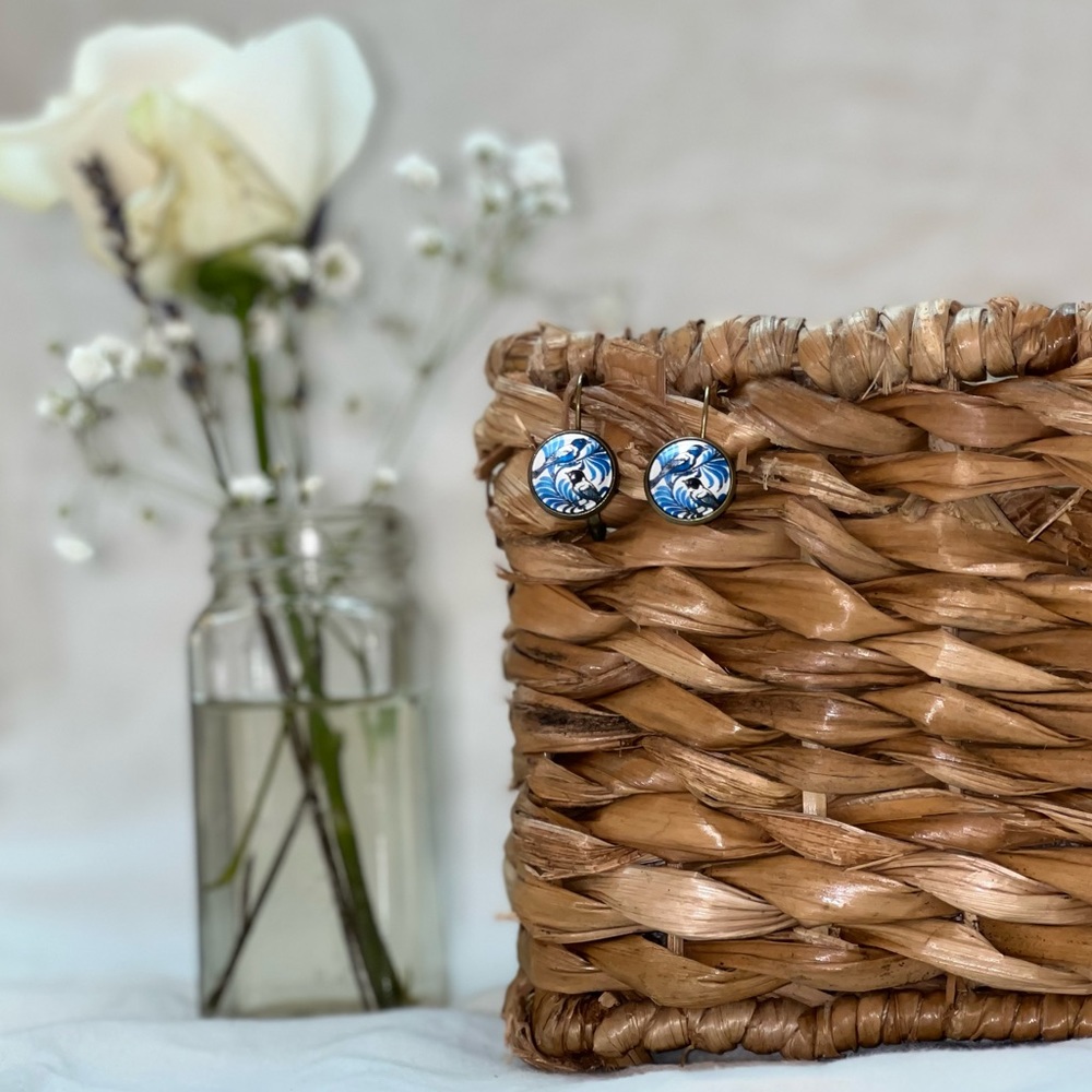 Vintage copper earrings with blue + white birds.
